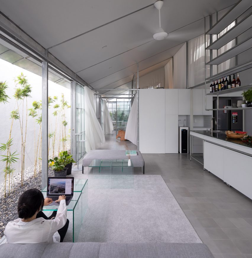 Open plan steel kitchen and living space with mono-pitched roof