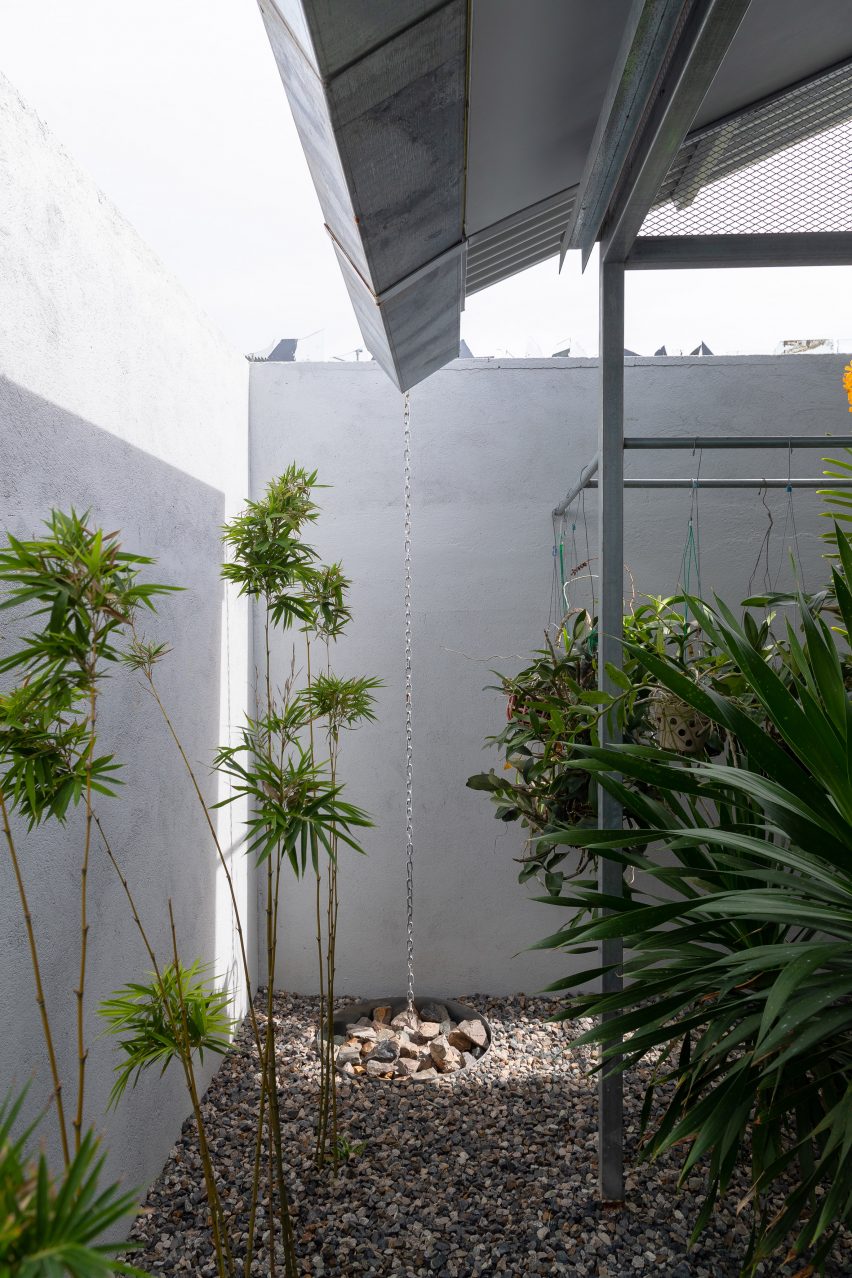 Outdoor courtyard with planting and pebble paving