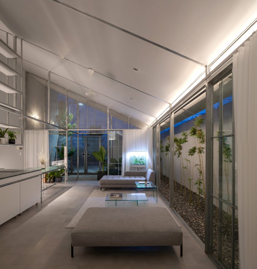 Open plan steel kitchen and living space with mono-pitched roof