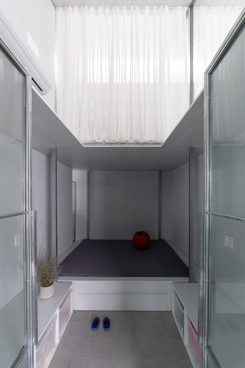 Compact children's bedroom with white curtains