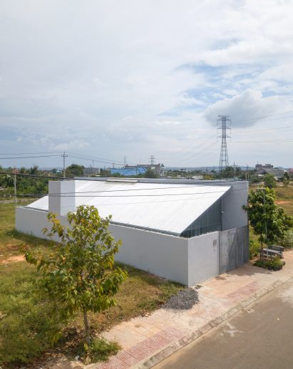Exterior of a steel mono-pitched house in Vietnam by MIA Design Studio