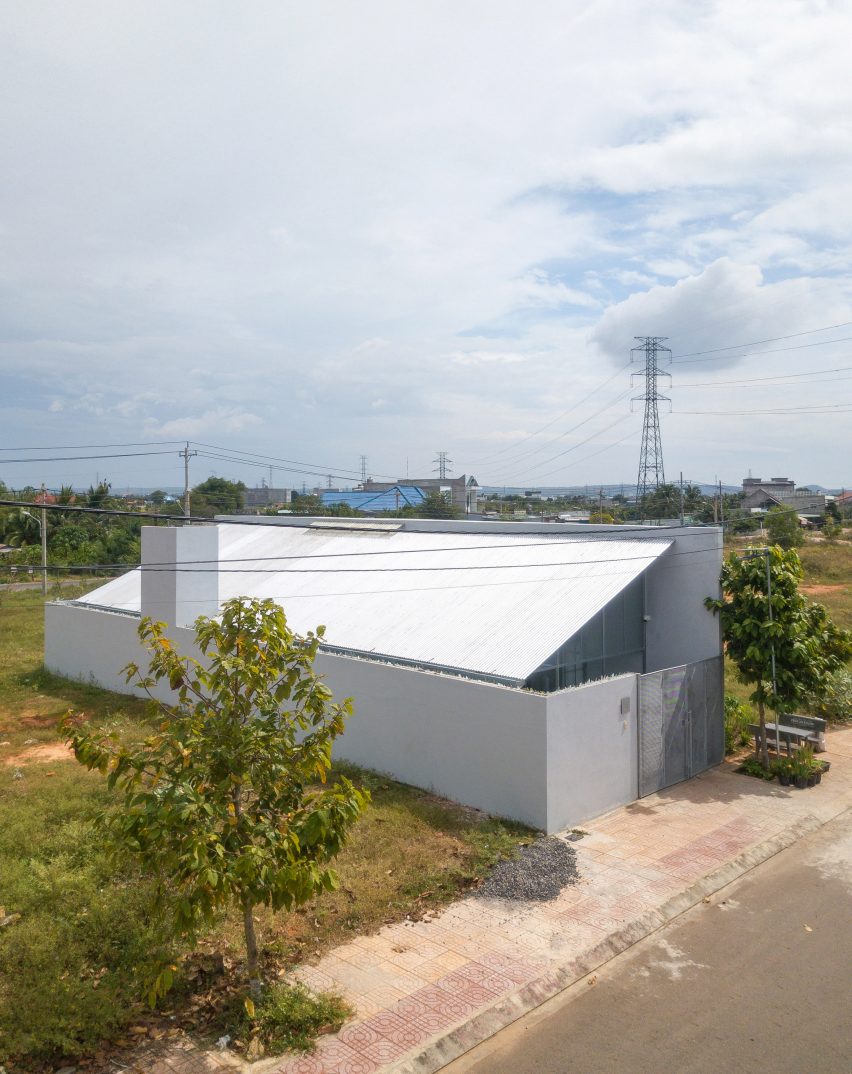 Exterior of a steel mono-pitched house in Vietnam by MIA Design Studio