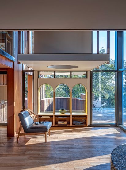 Arched windows and circular overhanging skylight in modernist home
