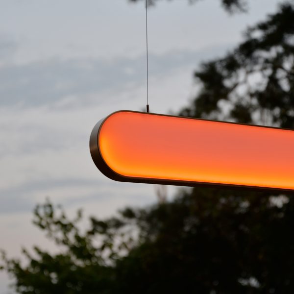Glowing orange lamp hung up