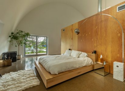 Spacious bedroom in apartment interior of Caterpillar by Undecorated