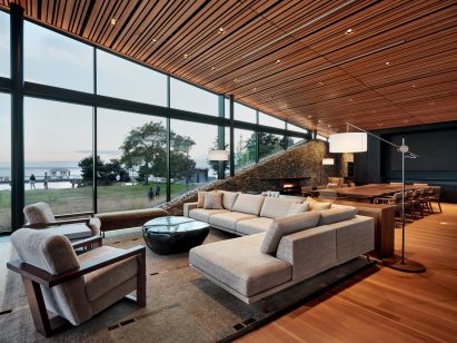 Casual seating area at The Prow with large glass windows