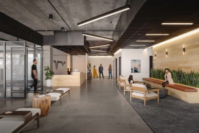Concrete and wooden interior of office by West of West