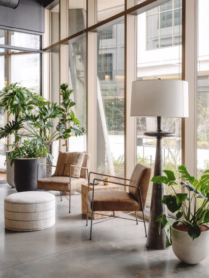 Storefront windows bounce light off polished office floors