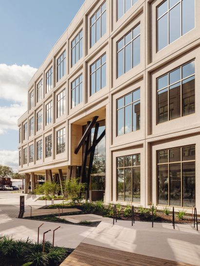 Large glass windows on Eastbound office block by West of West