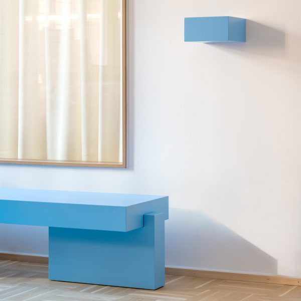 End of blue sideboard with small shelf above