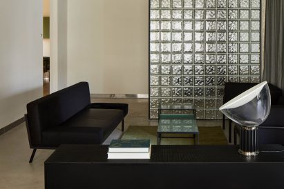Lounge area behind glass block wall