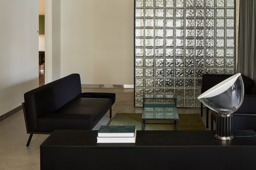 Lounge area behind glass block wall