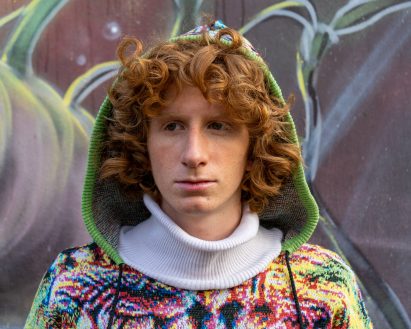 Person wearing a Cap_able hoddie