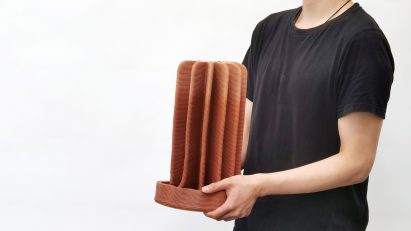 Person holding the clay humidifier