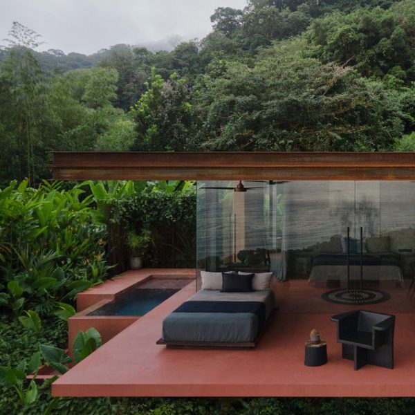 Floating villa of red rammed-earth in Coast Rica jungle by Formafatal