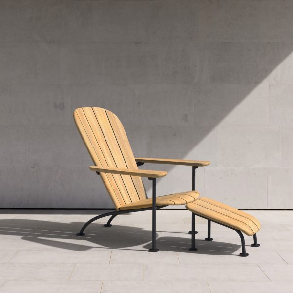 Wooden chair with foot rest in concrete area