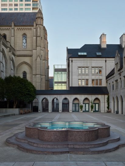 Exterior a cathedral and school with glass extension by Charles F Bloszies