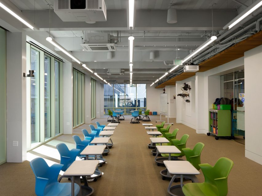 Interior school study space in individual desks and overhead lighting by Charles F Bloszies