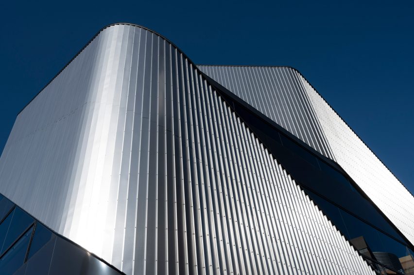 Close up of the sweeping steel panels at the 010 Building by Clouds AO