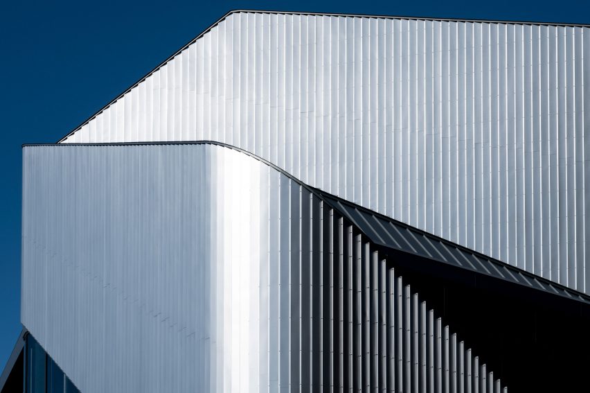 Close up of the sweeping steel panels at the 010 Building by Clouds AO