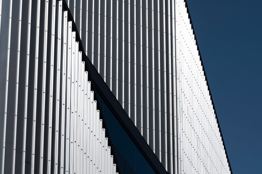 Close up of the sweeping steel panels at the 010 Building by Clouds AO