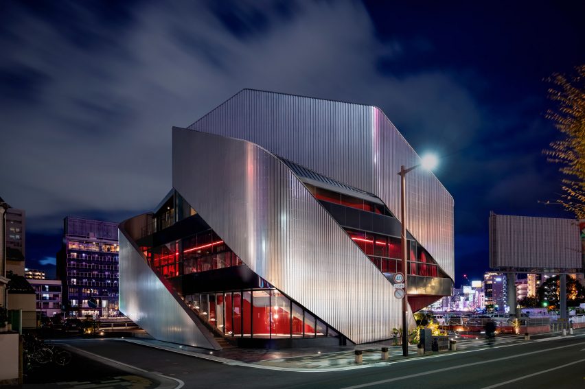 Exterior of a theatre building with sweeping steel panels by Clouds AO