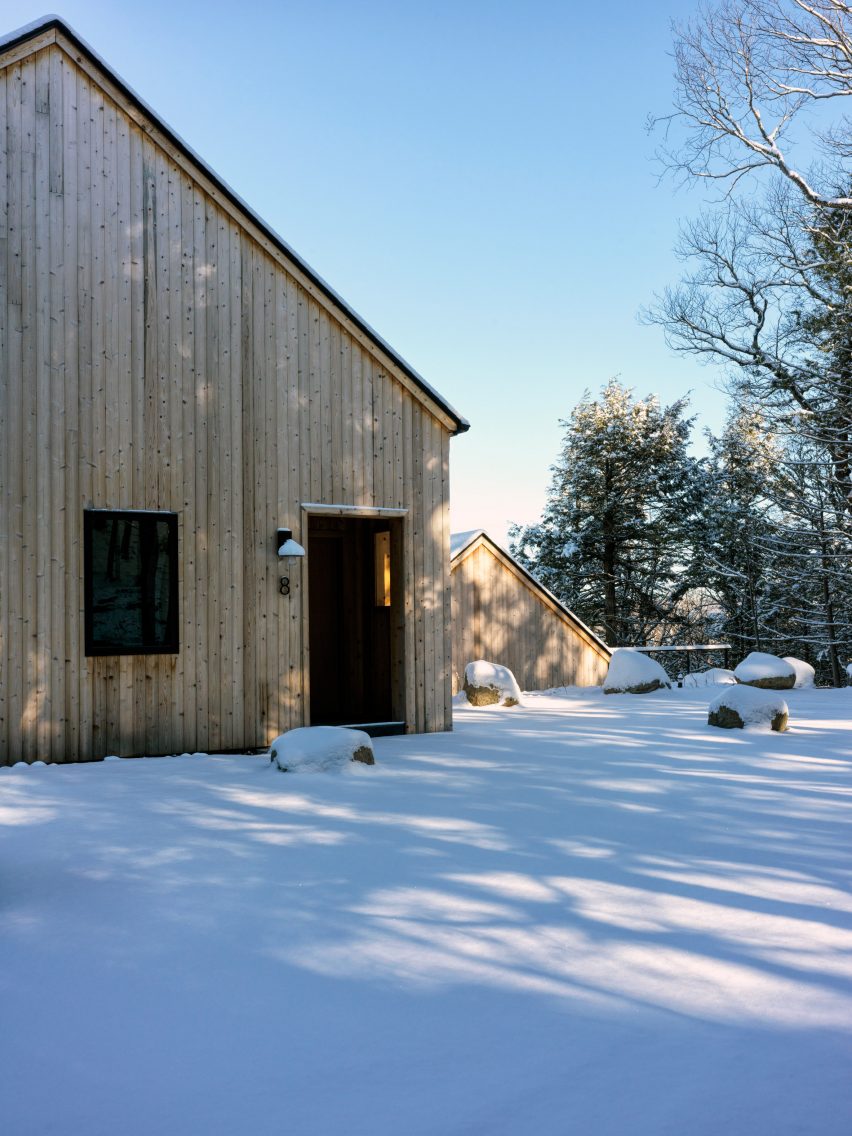 Gable end of a timber-clad home in the snow