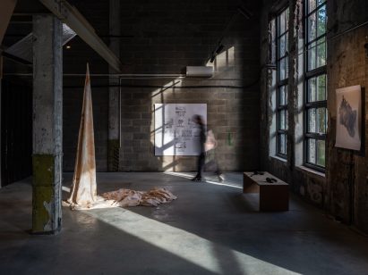 Photo of industrial loft space with large windows