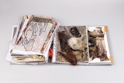 Photo of full research book laying on floor