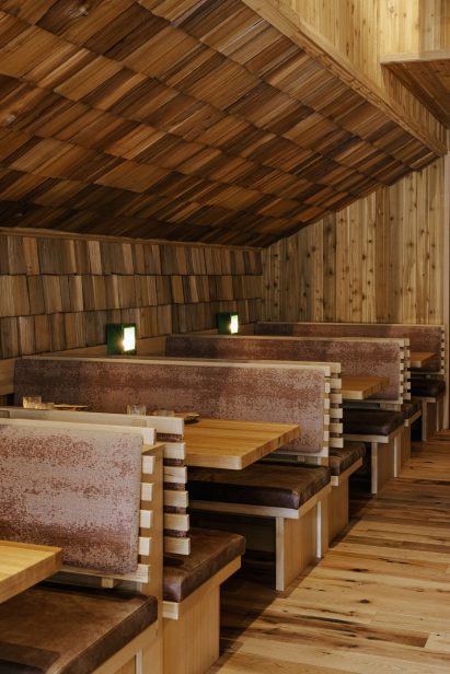 Booths beside angled shingle-covered walls
