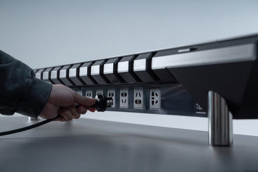 Photo of the back of the Hexcal Studio desktop management system showing multiple sockets
