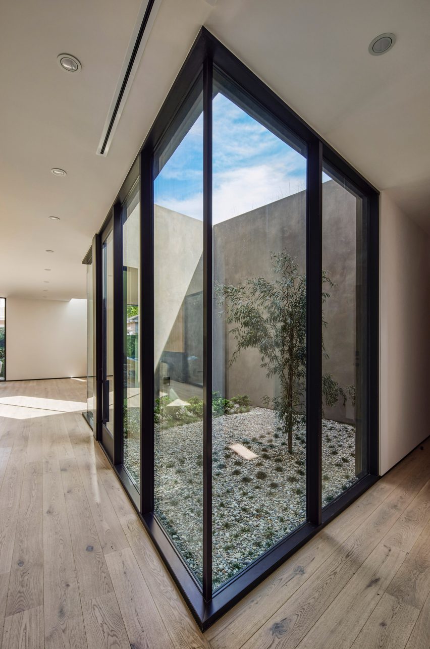 Corner window in a room overlooking an internal courtyard