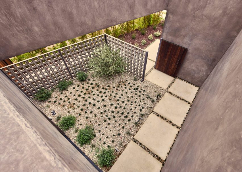 Roof terrace with planted garden and square paving tiles