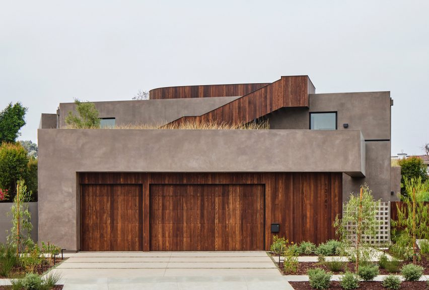 Exterior of a two-storey stucco and ash-clad home by Hsu McCullough