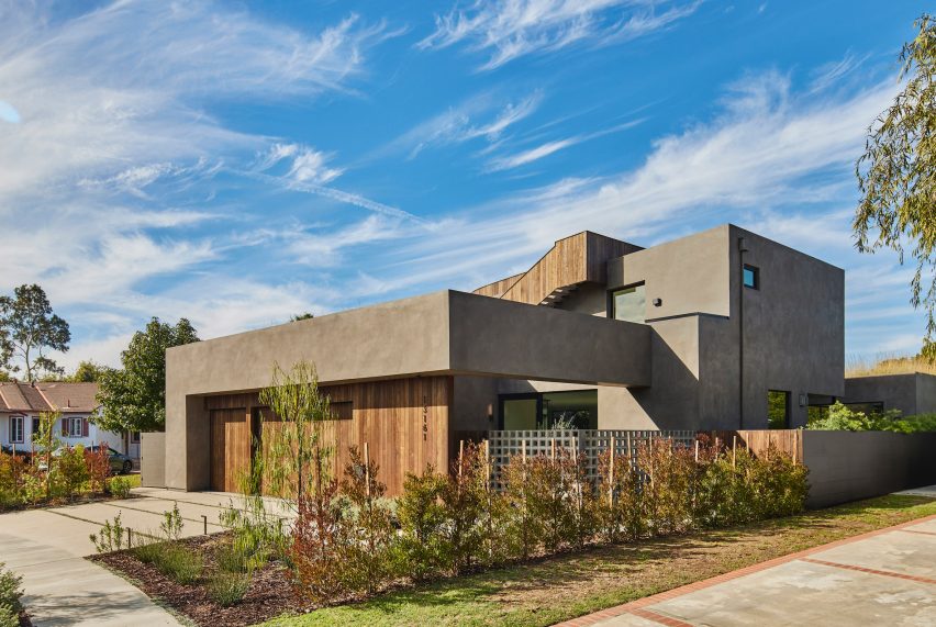 Exterior of a two-storey stucco and ash-clad home by Hsu McCullough