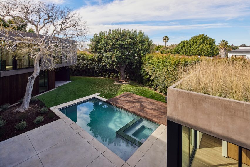 View from above of a garden with a swimming pool and elm tree