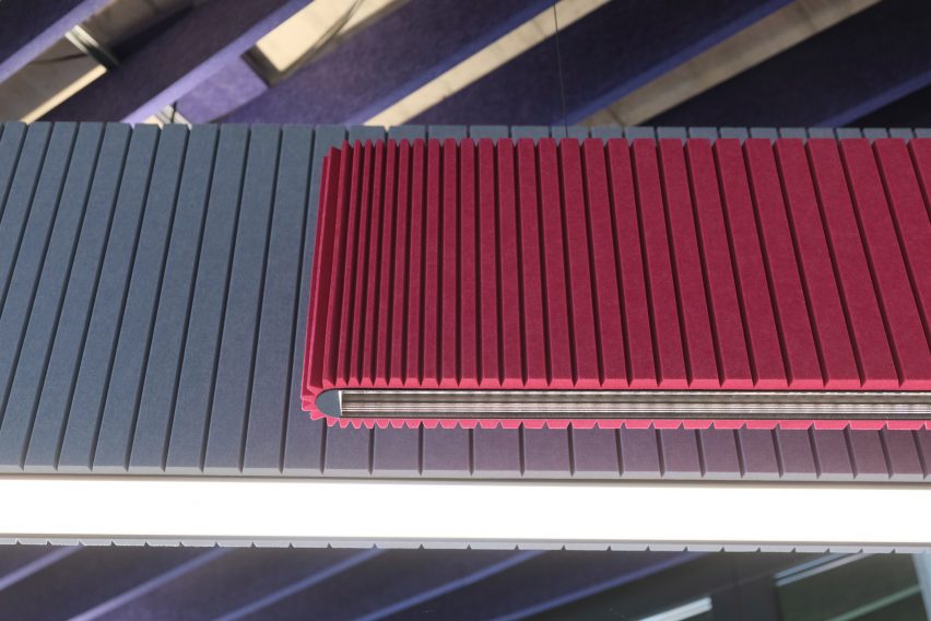 One pink and one blue pendant lamp with acoustic panelling