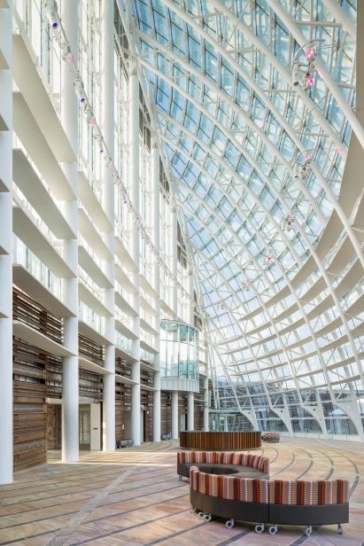 Interior of the entrance of the First Americans Museum with a curved glass facade
