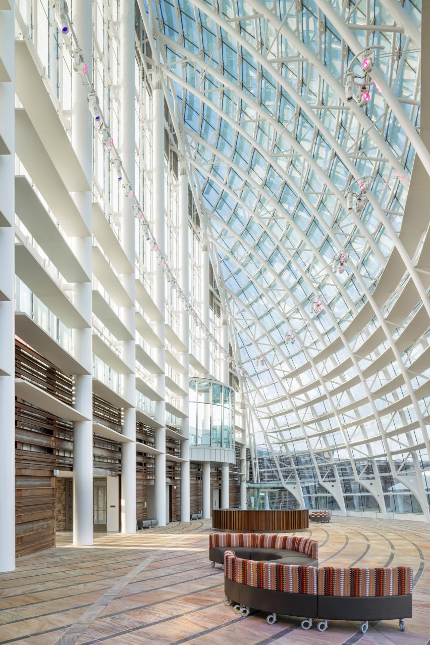 Interior of the entrance of the First Americans Museum with a curved glass facade