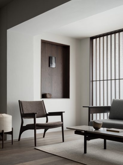 Dark-wood furniture in Kyoto showroom by Keiji Ashizawa