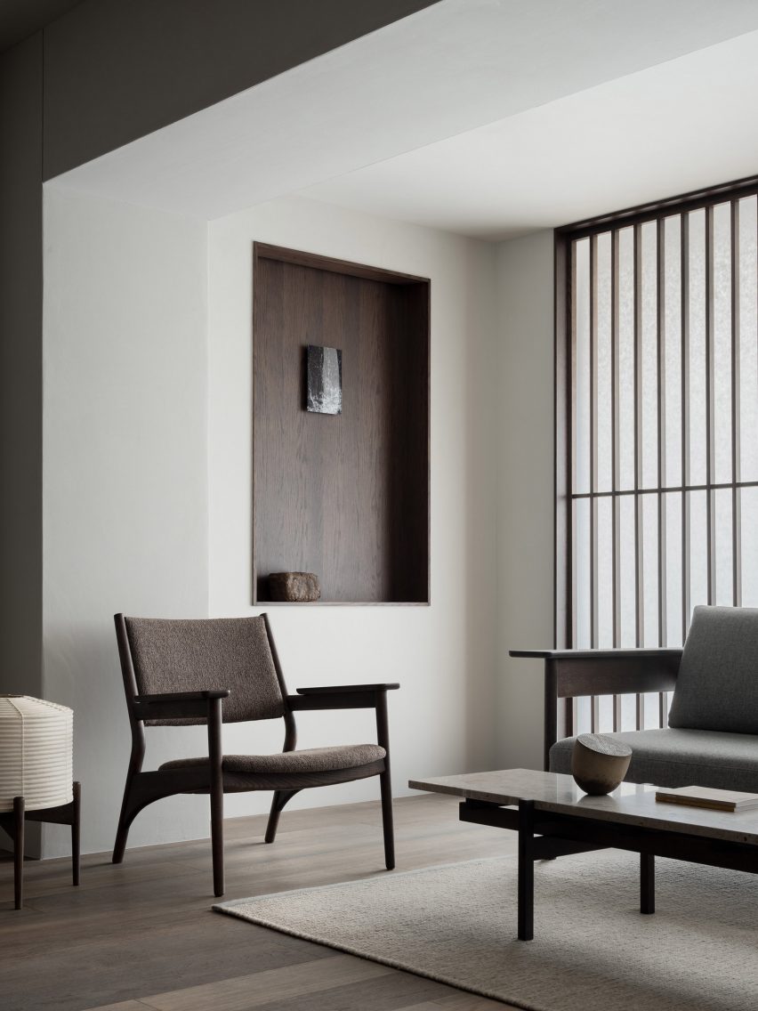 Dark-wood furniture in Kyoto showroom by Keiji Ashizawa