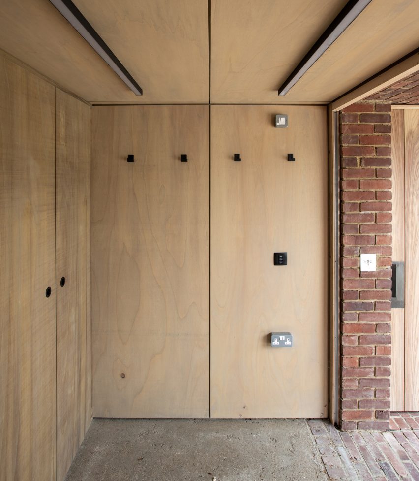 Interior of a pool house with fitted wooden storage