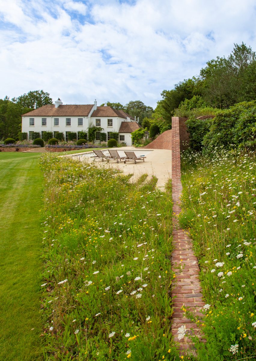 Brick curved pool house in the garden of a Georgian house in Kent