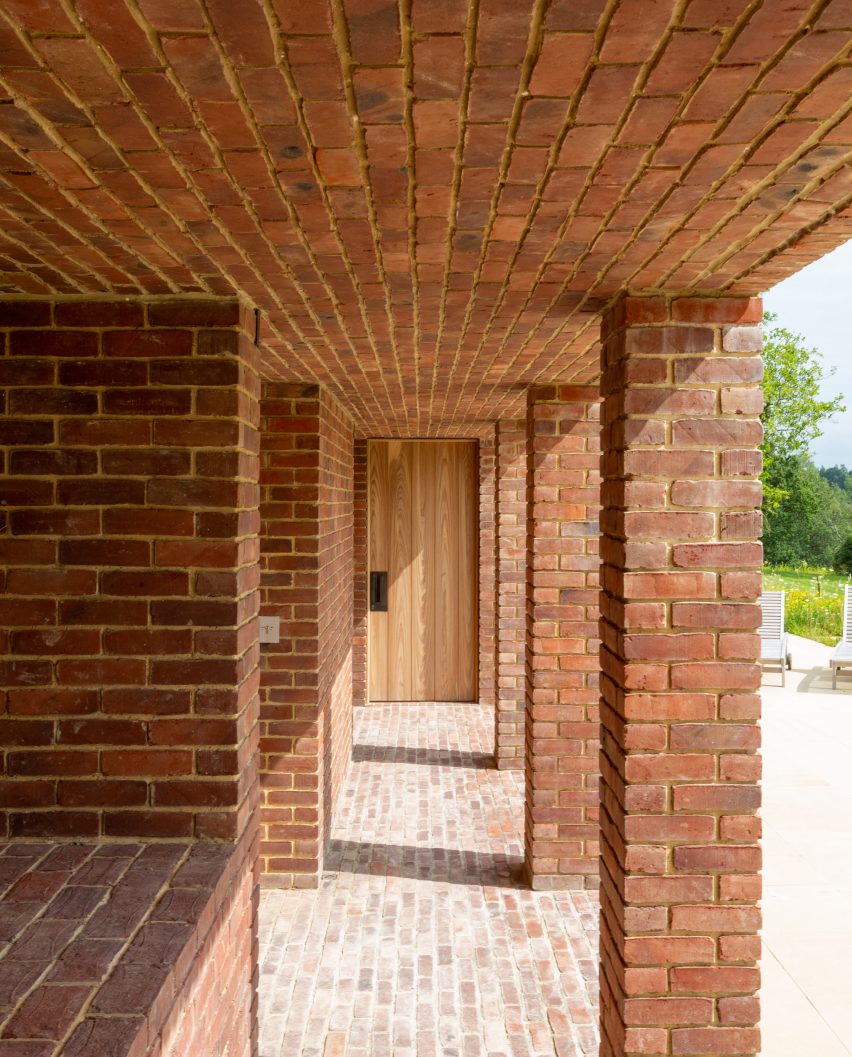 Brick pool house in the garden of a Georgian house in Kent