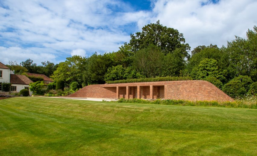 Brick pool house in the garden of a Georgian house in Kent