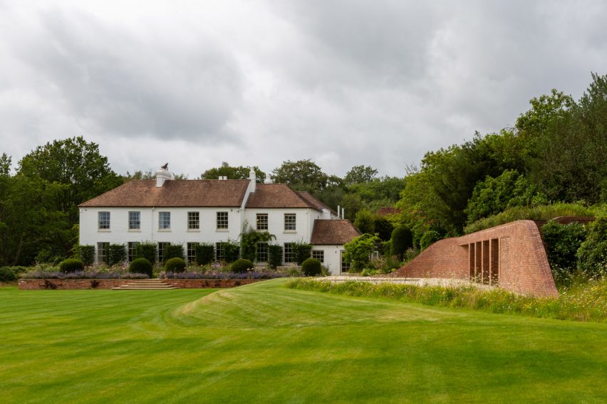 Brick pool house in the garden of a Georgian house in Kent