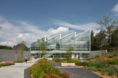Sawtooth roof on The Montreal Insectarium, surrounded by vegetation