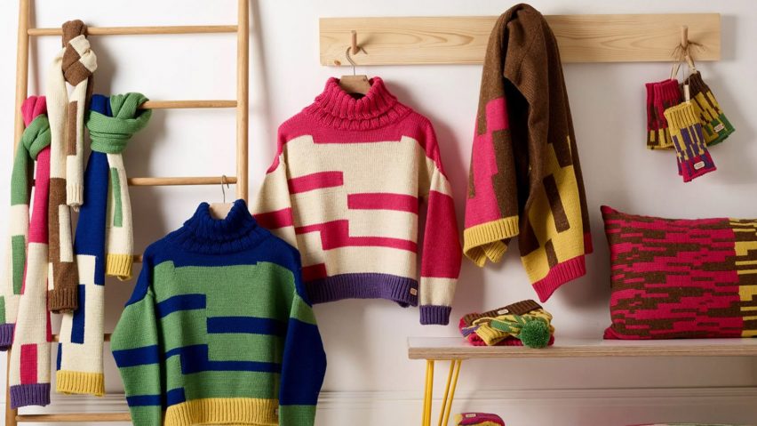 Display featuring brighly coloured and geometrically patterned knitted clothing and accessories