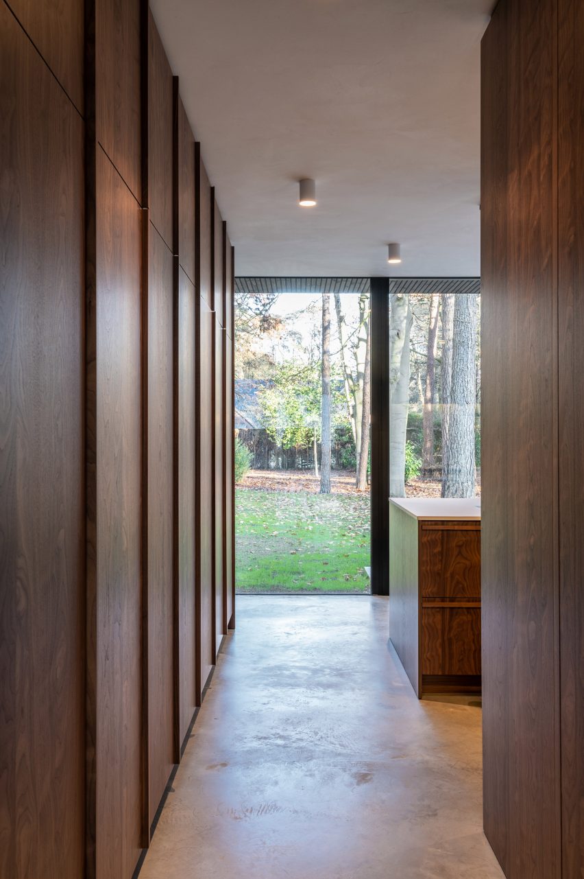 Interior of a narrow walkway with wood wall panelling