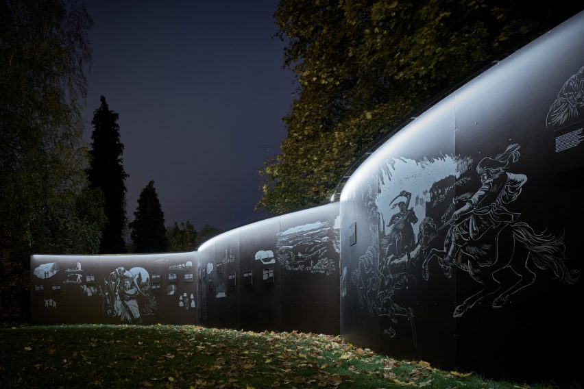 Photograph showing illustrations on inside of curved structure